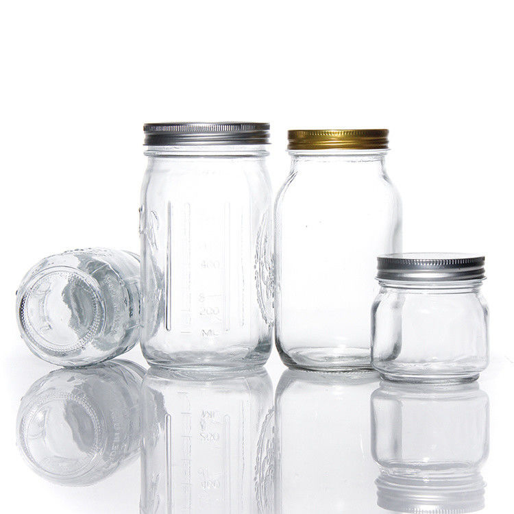 Producido varios tamaños de vidrio de cocina personalizado almacenamiento de alimentos de vidrio Mason Jar para dulces de galletas de especias