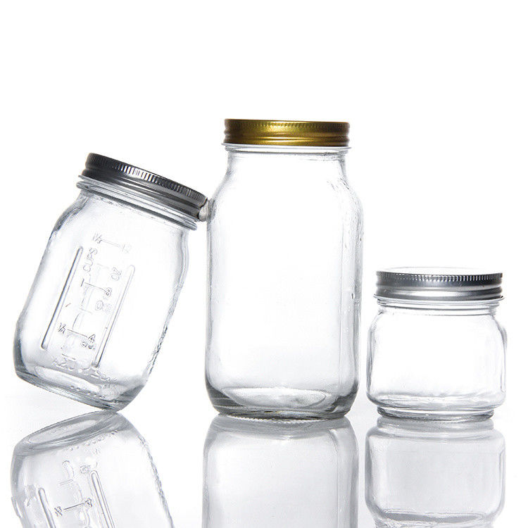 Diseño personalizado 8 Oz 16 Oz Contenedor de almacenamiento de alimentos Jarrón de vidrio Mason con tapas