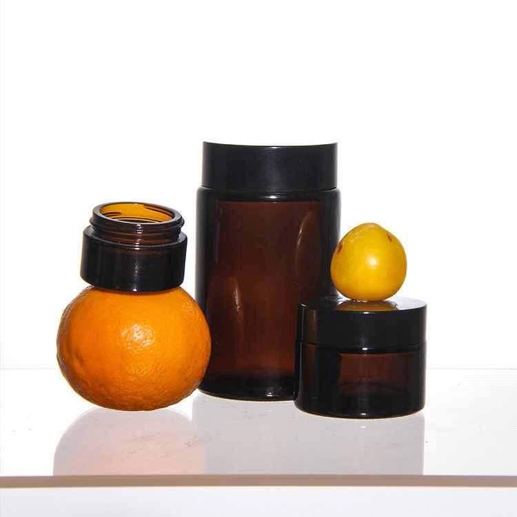 Cosméticos de colores de ODM Jarrones de vidrio de crema con tapa de acacia dorada