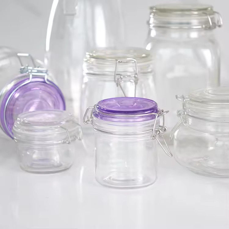 Popular Venta al por mayor 100ml 180ml 280ml Grado alimenticio Jarrón de vidrio redondo de miel con tapa de clip