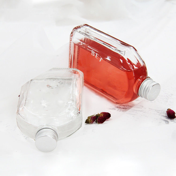 Nuevo diseño botella de vidrio de licor transparente de 200 ml 250 ml 300 ml con tapa de tornillo