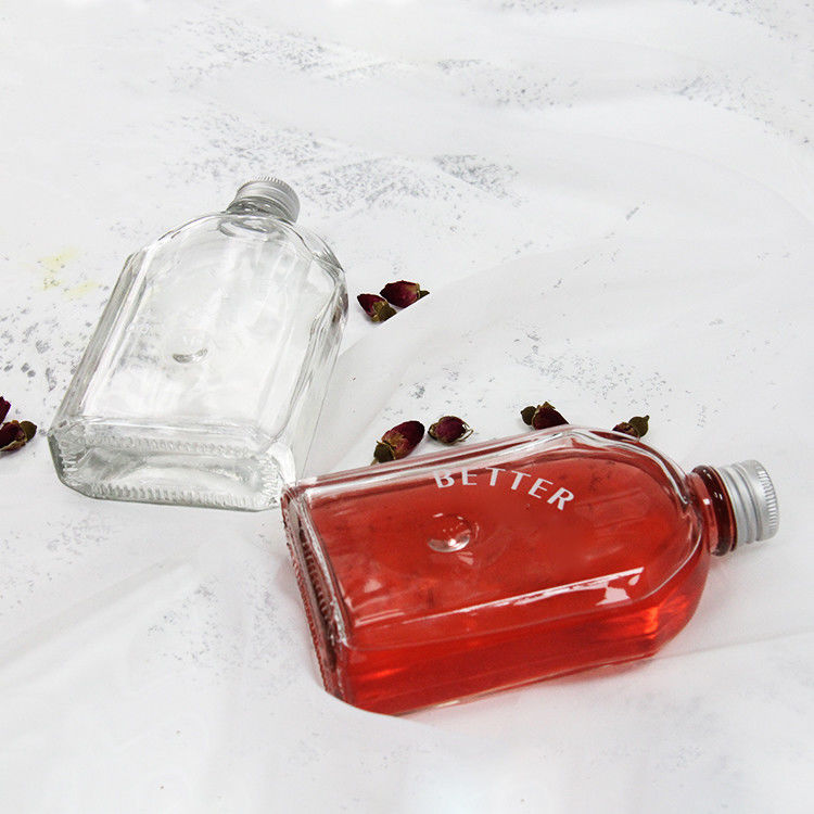 Nuevo diseño botella de vidrio de licor transparente de 200 ml 250 ml 300 ml con tapa de tornillo