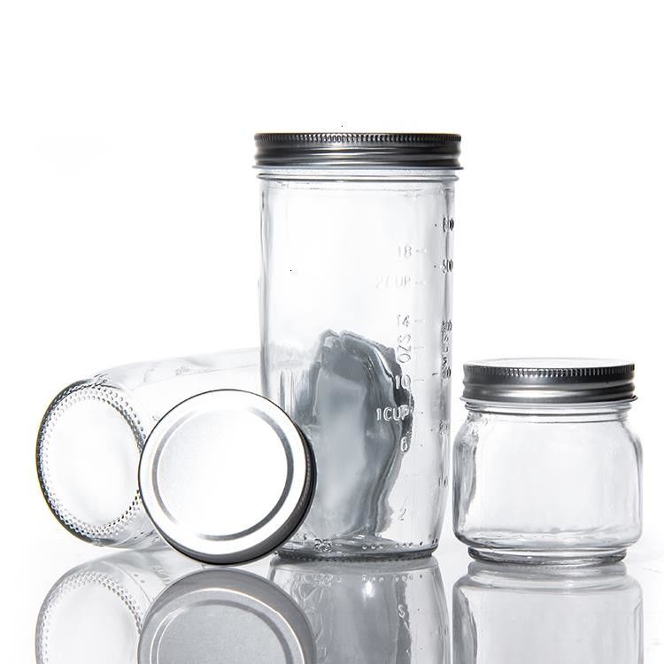 Diseño personalizado 8 Oz 16 Oz Contenedor de almacenamiento de alimentos Jarrón de vidrio Mason con tapas