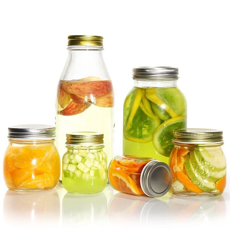Diseño personalizado 8 Oz 16 Oz Contenedor de almacenamiento de alimentos Jarrón de vidrio Mason con tapas