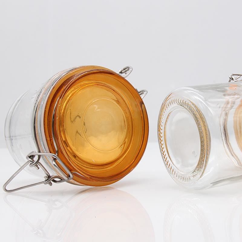 Envase de vidrio de venta al por mayor Especias claras Café galleta de vidrio Jar de vidrio de almacenamiento de alimentos Jar con tapa de vidrio de sello