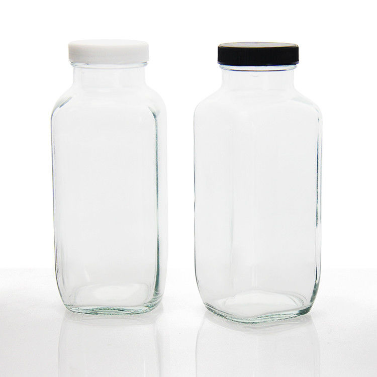 Botellas de jugo de vidrio cuadrada Botellas de jugo de vidrio con tapa a prueba de alteraciones para el embalaje de bebidas de jugo