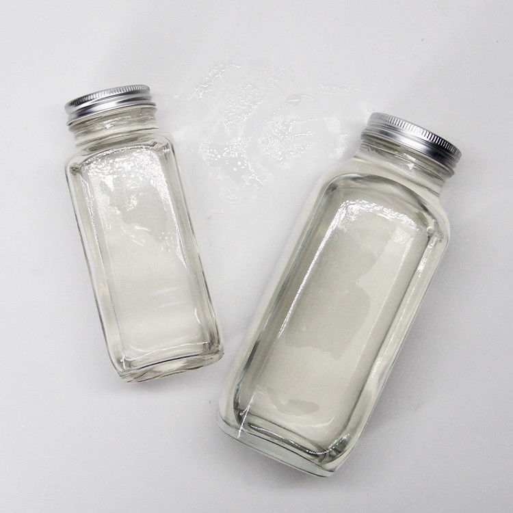 Botellas de jugo de vidrio cuadrada Botellas de jugo de vidrio con tapa a prueba de alteraciones para el embalaje de bebidas de jugo