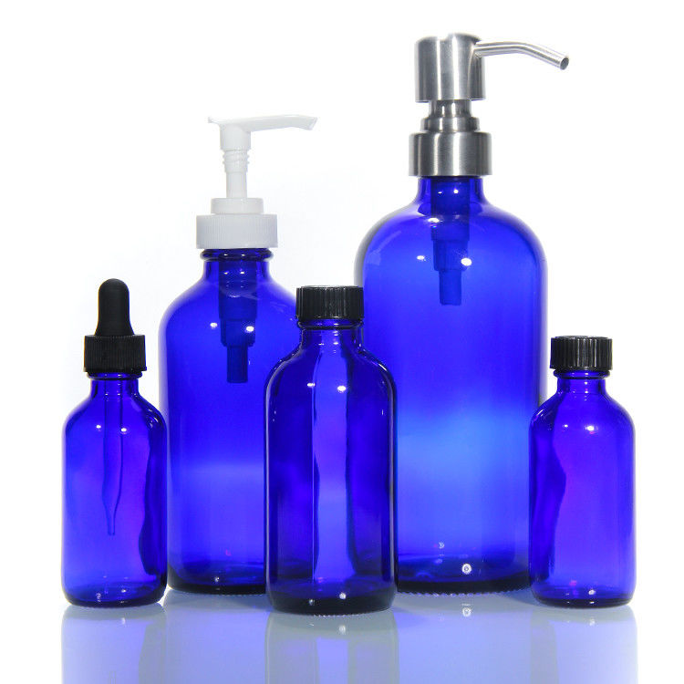 Botella de vidrio de lujo de color vacío Botella de vidrio con bomba de loción Botellas de vidrio cosméticos