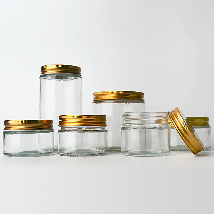 Suministro de fábrica 8 oz 12 oz vacío dulce claro recipientes redondos frascos de vidrio con tapas de metal de oro