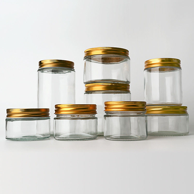 Suministro de fábrica 8 oz 12 oz vacío dulce claro recipientes redondos frascos de vidrio con tapas de metal de oro