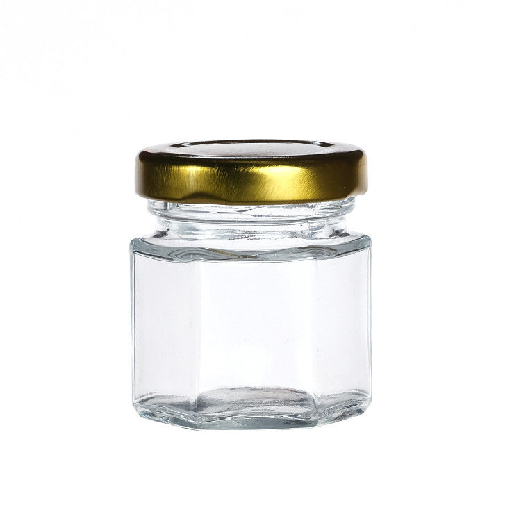 Jarrones de botellas transparentes con tapas Jarrón de almacenamiento de vidrio hexagonal para la lata de té