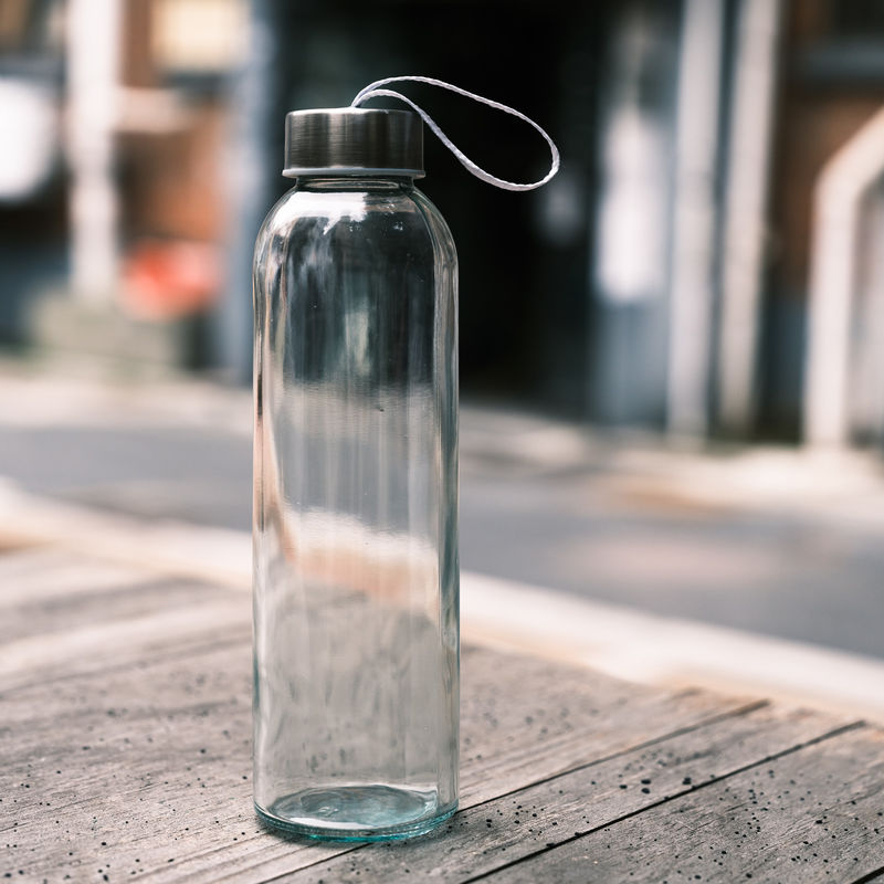 Botella de agua de vidrio de alto borosilicato con manga de silicona